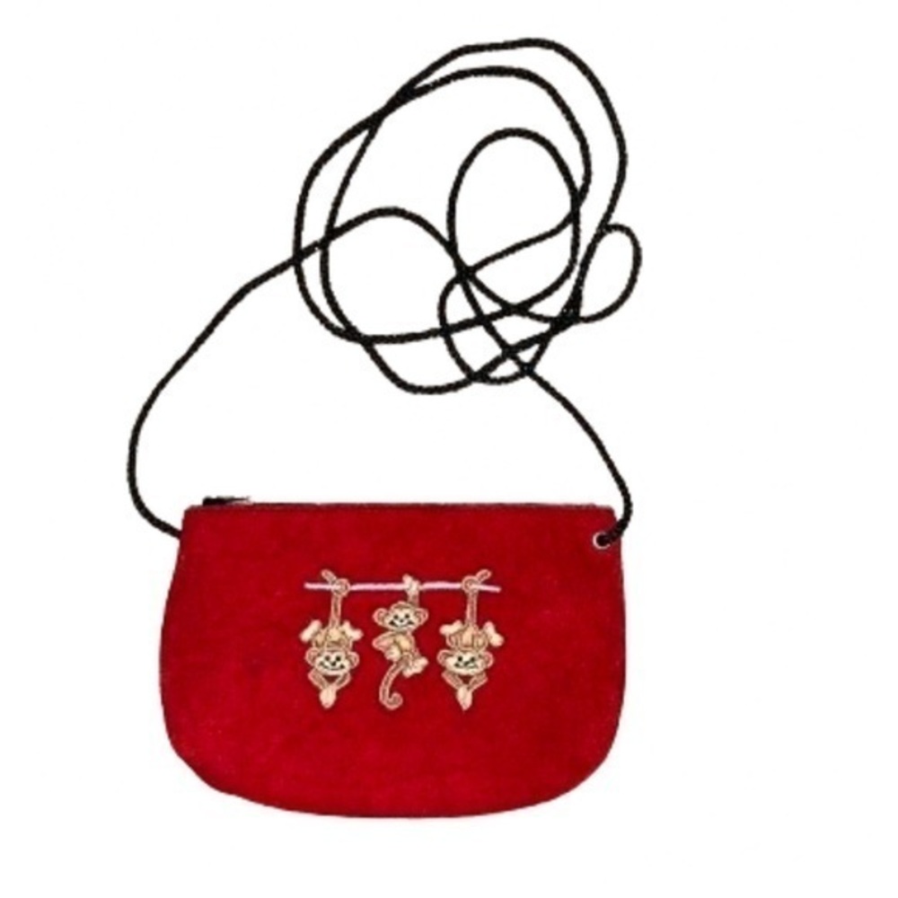 Red suede mini crossbody with monkey embroidery